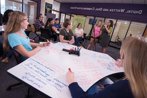 students sitting at table at dwoc